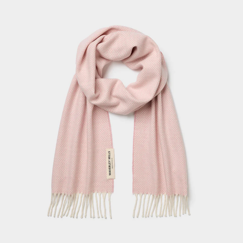 Pink scarf with white tassels on a light gray background Soft Luxurious