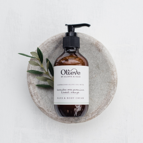 Organic moisturiser brown dispenser with white label and olive