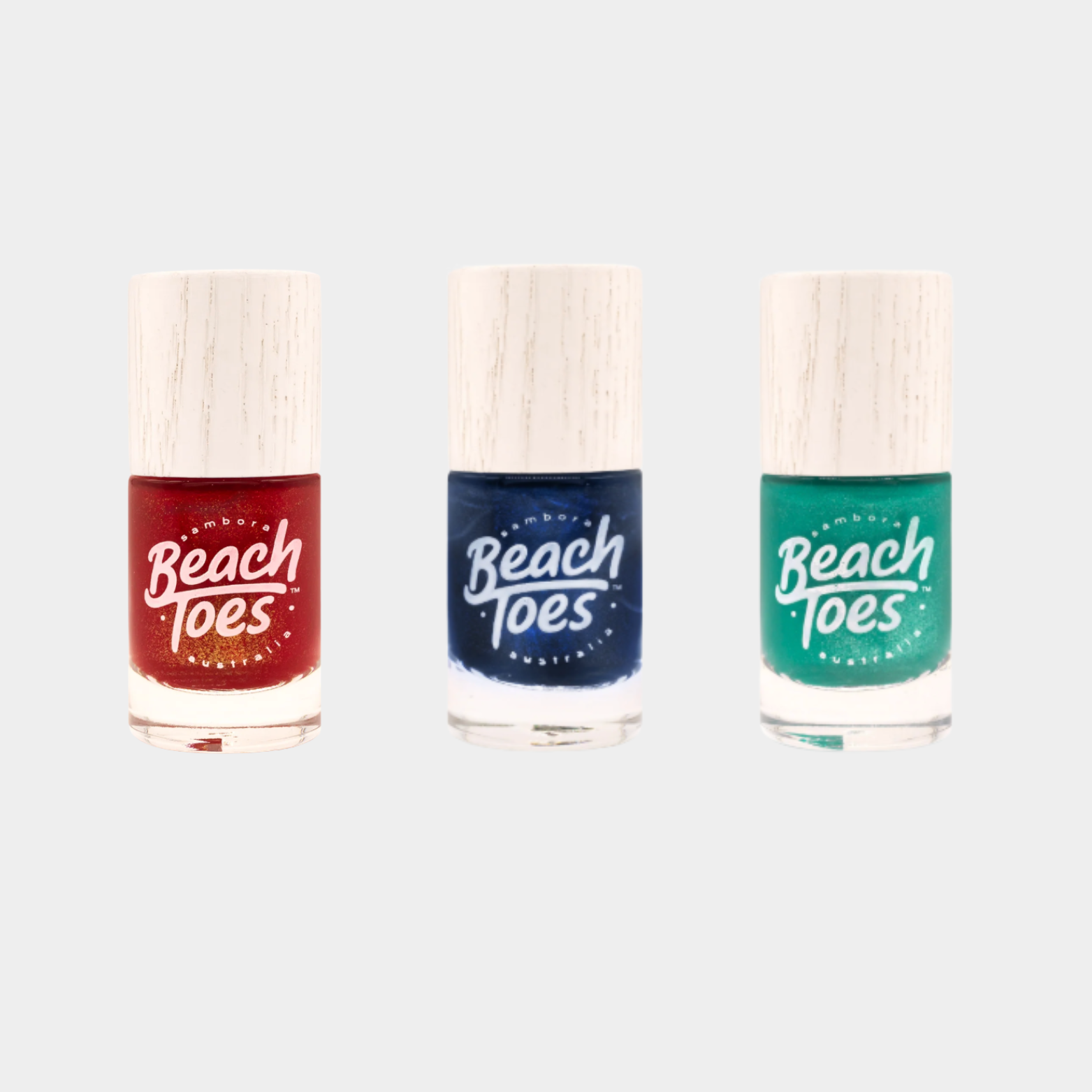 Three nail polish bottles with 'Beach Toes' branding on a light gray background
